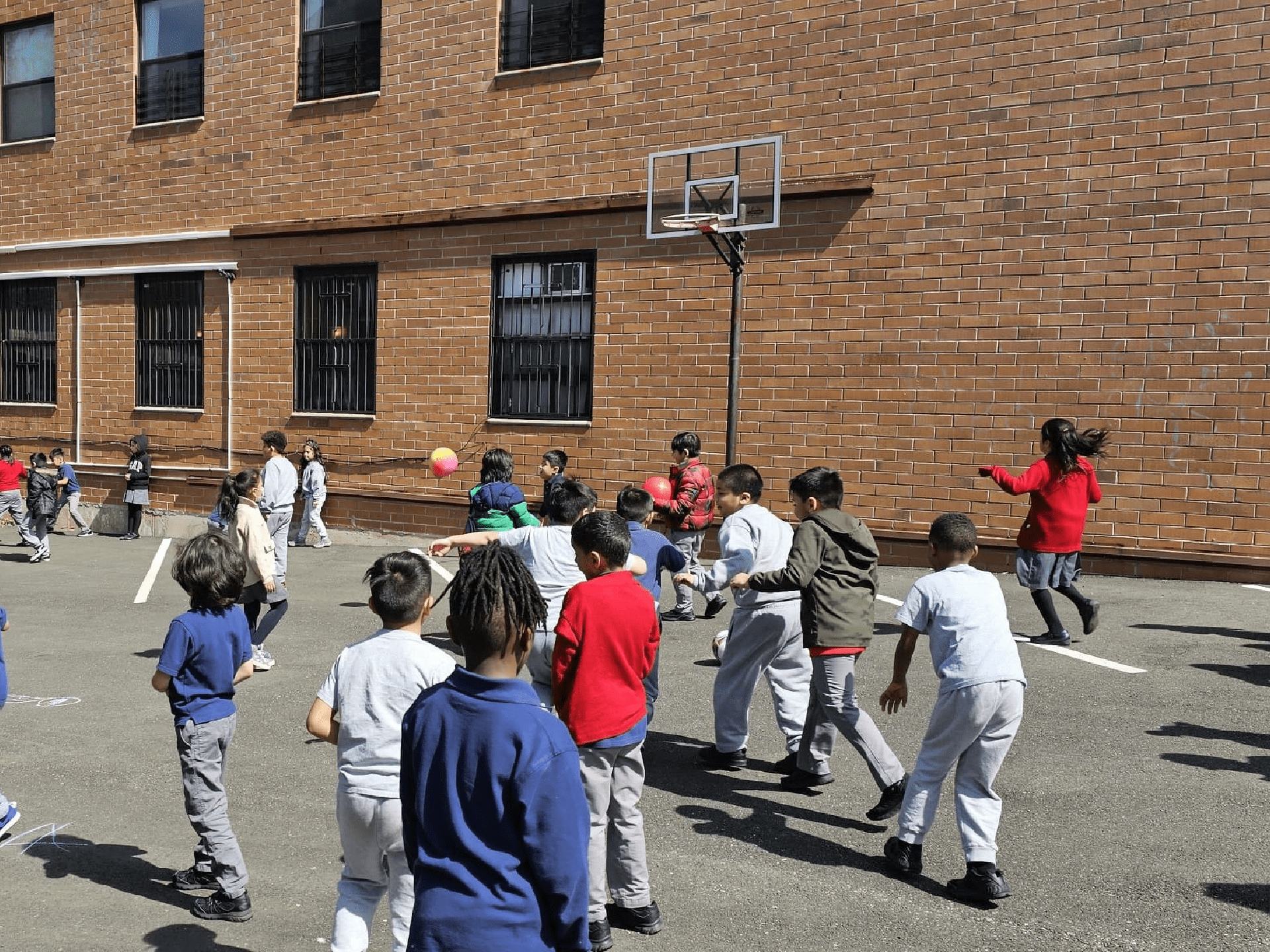 A children playing in basket ball area A children playing in basket ball area